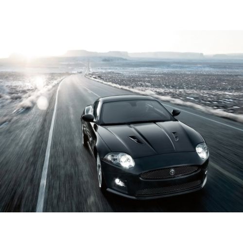 Black Sport Car On The Road Poster The Black Sport Car On The Road poster features a sleek and stylish black sports car speeding