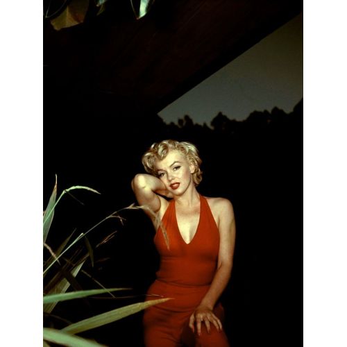 Marilyn Monroe In Red Dress Marilyn Monroe in Red Dress photo showcases the iconic actress in a stunning red gown, exuding