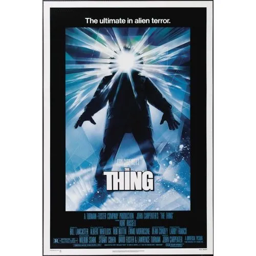 The Thing Movie Poster The movie poster of The Thing is a representation of the iconic 1982 horror/science fiction film.